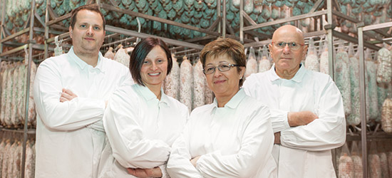 Le origini della tradizione salumiera: foto storica della famiglia e della passione norcina di Artigian Carni - Felino Parma
